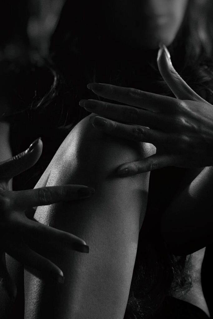 pexels-photo-1097893-1097893 Dramatic black and white silhouette of a woman's hands and body in studio lighting.
